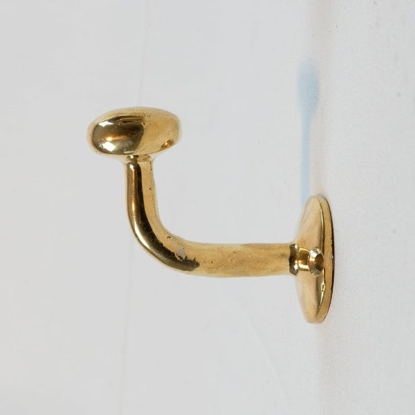 https://www.brassna.com/cdn/shop/products/set-of-handcrafted-unlacquered-brass-hooks-for-wall-204486_grande.jpg?v=1705537991